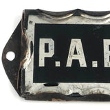 P.A. Baker, Silver Foil and Reverse Painted Glass Nameplate with Scalloped Edge