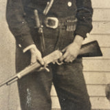 Man with Knife and Rifle, Dog with Head Turned, Large Paper Print Photo