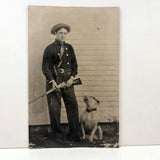 Man with Knife and Rifle, Dog with Head Turned, Large Paper Print Photo