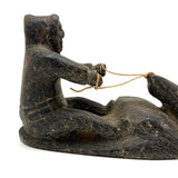 Striking and Sensitive Inuit Stone Carving of Man and Seal with Sinew Reins (Shoulder Repair)