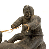 Striking and Sensitive Inuit Stone Carving of Man and Seal with Sinew Reins (Shoulder Repair)