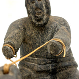 Striking and Sensitive Inuit Stone Carving of Man and Seal with Sinew Reins (Shoulder Repair)