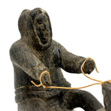Striking and Sensitive Inuit Stone Carving of Man and Seal with Sinew Reins (Shoulder Repair)