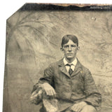 Melancholic Looking Young Man Against Whispy, Moody Painted Backdrop