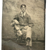 Melancholic Looking Young Man Against Whispy, Moody Painted Backdrop