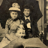 Threesome with Two Umbrellas and a Perched Bowler, Curious Antique Tintype