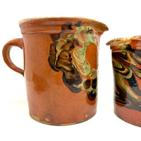 Pair of 19th Century French Rustic Marble Glazed Redware Pitchers