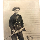Man with Knife and Rifle, Dog with Head Turned, Large Paper Print Photo