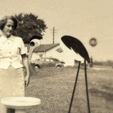 Woman with Stork and Bird Bath at Gulf Gas Station, Curious Little Trick Snapshot, c. 1940s