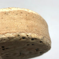 Ice Cream Sandwich of an Antique Pincushion with Handwoven Woolen Edging