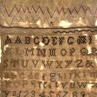 Mary Davis' Early Sampler with Flame Stitch, Alphabets, Flower and Verse