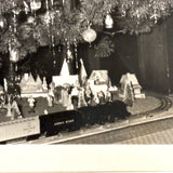 Beaming Boy with Christmas Tree, Lionel Train, Diversely Populated Putz Village