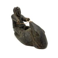 Striking and Sensitive Inuit Stone Carving of Man and Seal with Sinew Reins (Shoulder Repair)