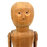 Tall and Wide Eyed Articulated Figure with Little Mouth and Ached Eyebrows