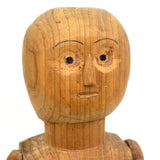 Tall and Wide Eyed Articulated Figure with Little Mouth and Ached Eyebrows