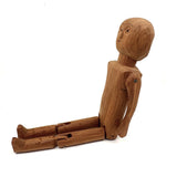 Tall and Wide Eyed Articulated Figure with Little Mouth and Ached Eyebrows