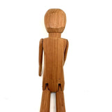 Tall and Wide Eyed Articulated Figure with Little Mouth and Ached Eyebrows
