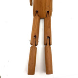 Tall and Wide Eyed Articulated Figure with Little Mouth and Ached Eyebrows