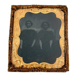 Dark and Moody Early Tintype of Two China Dolls and their Bed