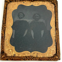 Dark and Moody Early Tintype of Two China Dolls and their Bed