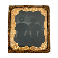 Dark and Moody Early Tintype of Two China Dolls and their Bed
