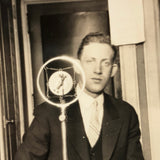 Wonderful c. late 20s/early 30s Snapshot of Man at Microphone Framed in Verticals