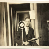 Wonderful c. late 20s/early 30s Snapshot of Man at Microphone Framed in Verticals