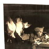 Dramatic Photo of Man at Work on Wings in Barn, with Hanging Geese and Flock of Sheep