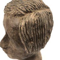 Expressive Hand-sculpted Clay Bust of a Sensitive Looking Boy