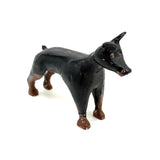 Alert and Poised to Pounce, with Twitching Ear,  Folk Carving Of Black and Brown Dog