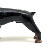 Alert and Poised to Pounce, with Twitching Ear,  Folk Carving Of Black and Brown Dog