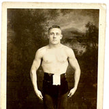 Young Wrestler/Strongman in Prize Belt and Balletic Pose, Antique RPPC (with Bloodstain on Reverse)