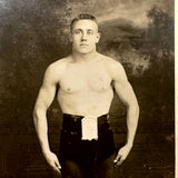 Young Wrestler/Strongman in Prize Belt and Balletic Pose, Antique RPPC (with Bloodstain on Reverse)