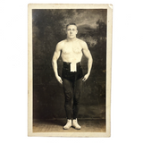 Young Wrestler/Strongman in Prize Belt and Balletic Pose, Antique RPPC (with Bloodstain on Reverse)