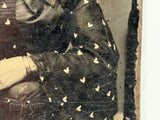 Mystical Looking Young Woman in Black Dress with Cross, Curls, and Heart-like Butterflies