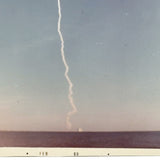 Trail of Smoke Across Hazy Blue Sky, Poignant 1969 Kodak Snapshot