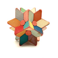 Many Faceted Hand-sewn Cloth over Board Star in Ice Cream Colors with Rattle Inside