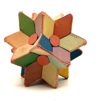 Many Faceted Hand-sewn Cloth over Board Star in Ice Cream Colors with Rattle Inside