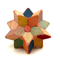 Many Faceted Hand-sewn Cloth over Board Star in Ice Cream Colors with Rattle Inside