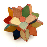 Many Faceted Hand-sewn Cloth over Board Star in Ice Cream Colors with Rattle Inside