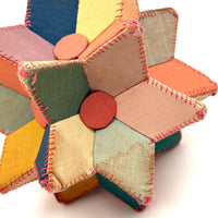 Many Faceted Hand-sewn Cloth over Board Star in Ice Cream Colors with Rattle Inside