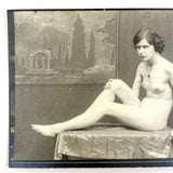 Nude Staring Back,  Loaded Antique Photograph of Model on Table with Wrinkled Fabric and Painted Backdrop