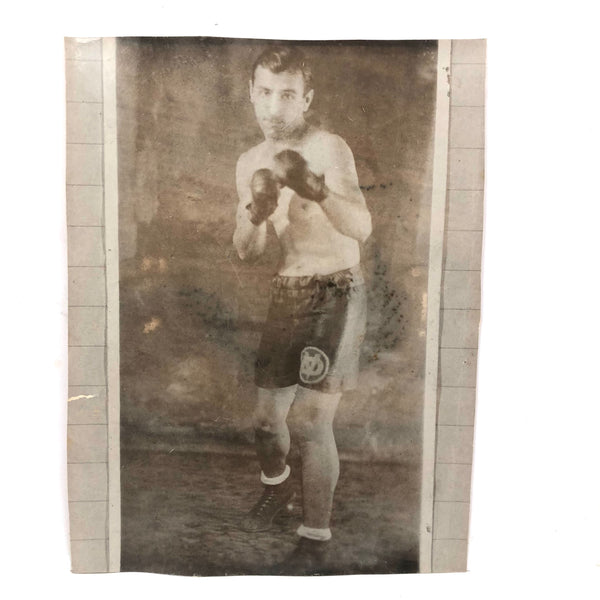 Photo of Photo of Young Boxer Against Lined Paper