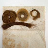 Annotated Collected Hair Locks Stitched to Paper with Handwritten Names #2 (Ginger George and Little George), 1860s