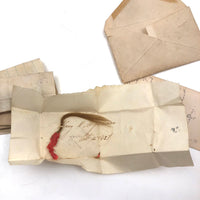 Exactly As Found: 1850s Envelop Filled with Seven Wrapped and Labeled Hair Samples