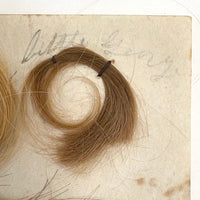 Annotated Collected Hair Locks Stitched to Paper with Handwritten Names #2 (Ginger George and Little George), 1860s
