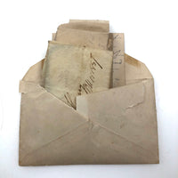 Exactly As Found: 1850s Envelop Filled with Seven Wrapped and Labeled Hair Samples