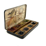 No. A1: Early Milton Bradley Watercolor Tin with Excellent Graphics, Blotter Papers, and Well Used Colors, c. 1890