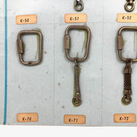 Vintage Salesman Sample Keychains Display on Sky Blue Board