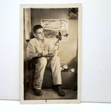 Dreamy Young Man in Pajamas with Airplanes